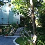 Stairs and porch, driveway lined with Belgian block